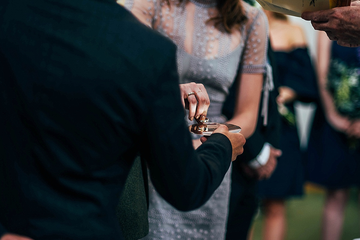 Bride Amelia wore a pale blue/grey Self Portrait dress for her handmade and stripped back, non traditional wedding. Captured by Three Flowers Photography.