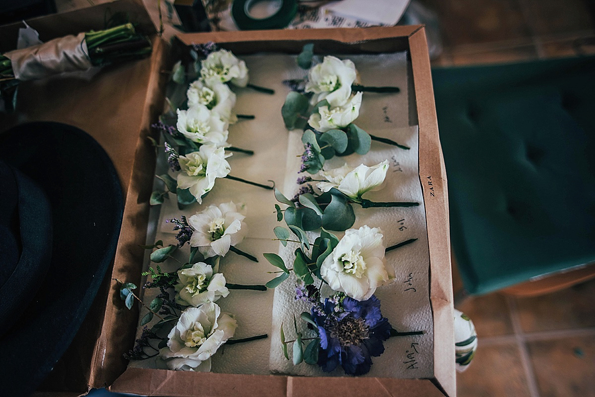 Bride Amelia wore a pale blue/grey Self Portrait dress for her handmade and stripped back, non traditional wedding. Captured by Three Flowers Photography.