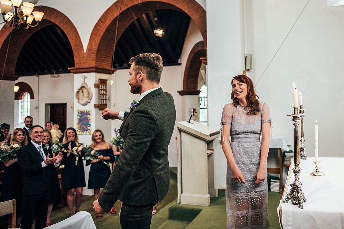 Bride Amelia wore a pale blue/grey Self Portrait dress for her handmade and stripped back, non traditional wedding. Captured by Three Flowers Photography.