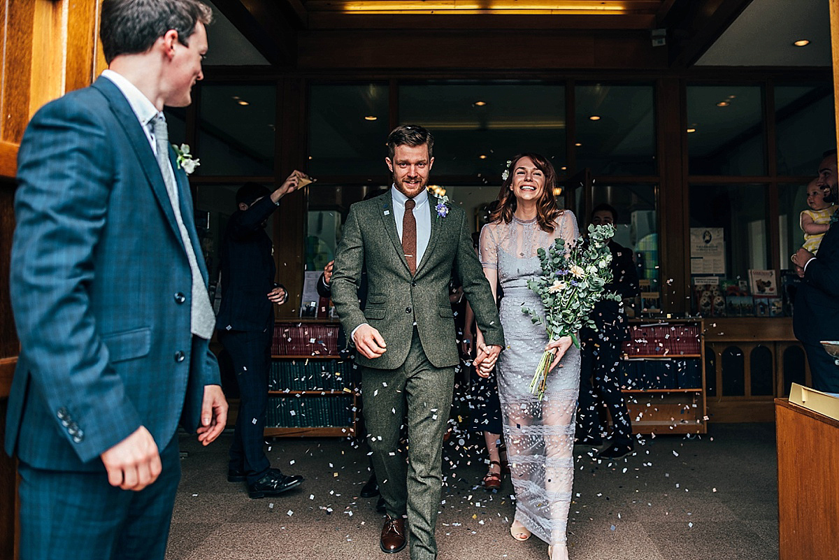 Bride Amelia wore a pale blue/grey Self Portrait dress for her handmade and stripped back, non traditional wedding. Captured by Three Flowers Photography.