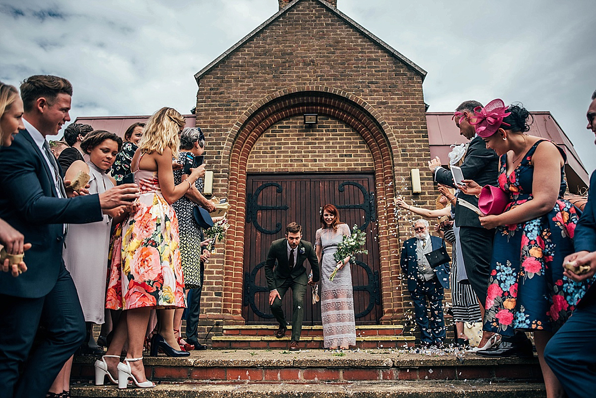 Bride Amelia wore a pale blue/grey Self Portrait dress for her handmade and stripped back, non traditional wedding. Captured by Three Flowers Photography.