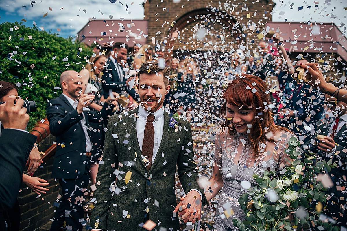 Bride Amelia wore a pale blue/grey Self Portrait dress for her handmade and stripped back, non traditional wedding. Captured by Three Flowers Photography.
