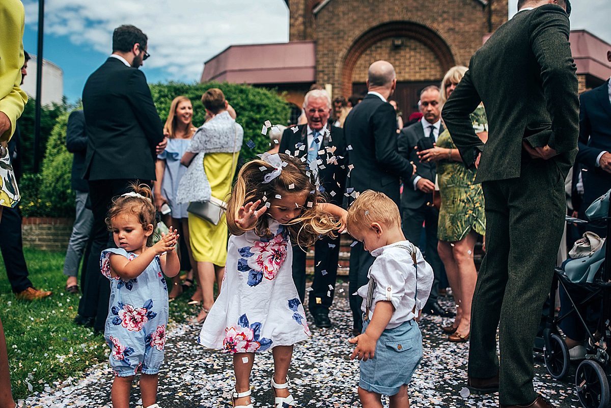 Bride Amelia wore a pale blue/grey Self Portrait dress for her handmade and stripped back, non traditional wedding. Captured by Three Flowers Photography.