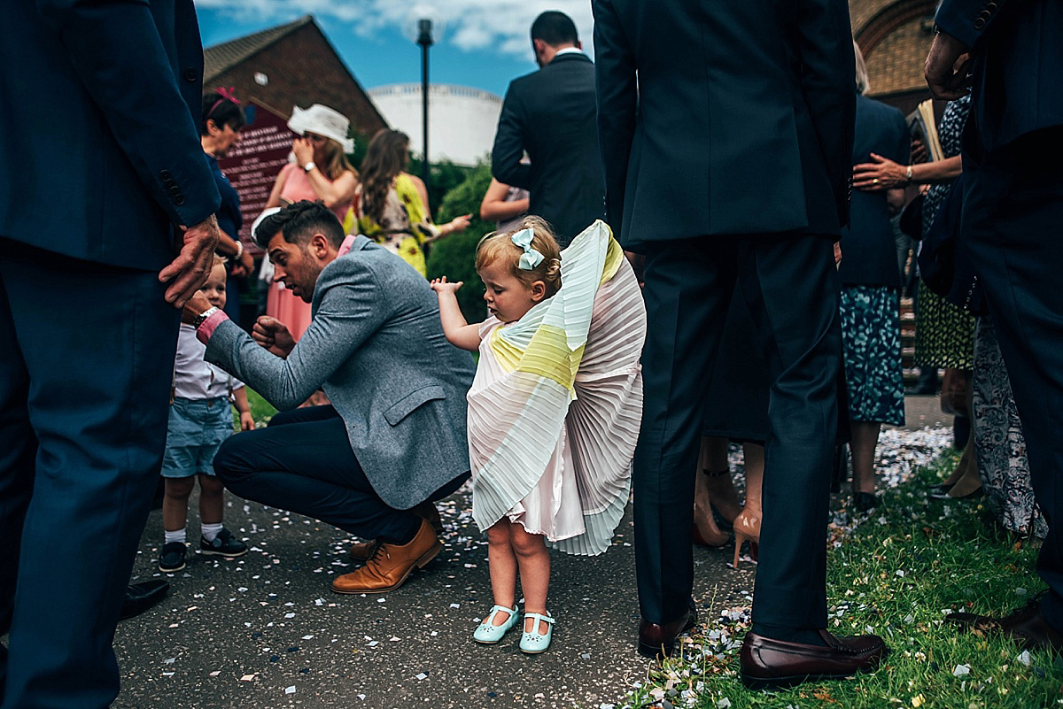 Bride Amelia wore a pale blue/grey Self Portrait dress for her handmade and stripped back, non traditional wedding. Captured by Three Flowers Photography.