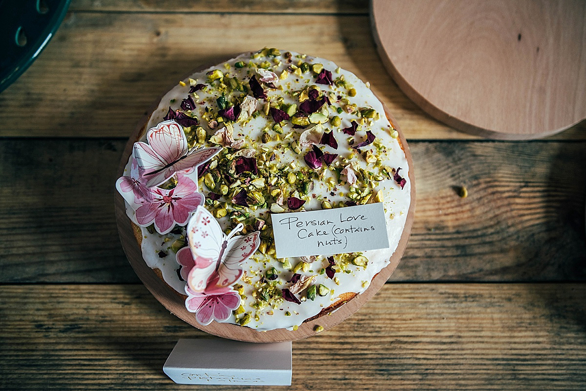 Bride Amelia wore a pale blue/grey Self Portrait dress for her handmade and stripped back, non traditional wedding. Captured by Three Flowers Photography.