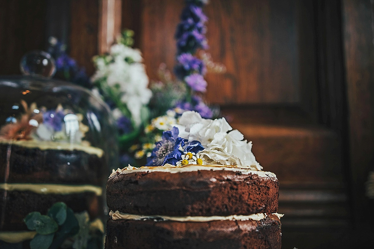 Bride Amelia wore a pale blue/grey Self Portrait dress for her handmade and stripped back, non traditional wedding. Captured by Three Flowers Photography.