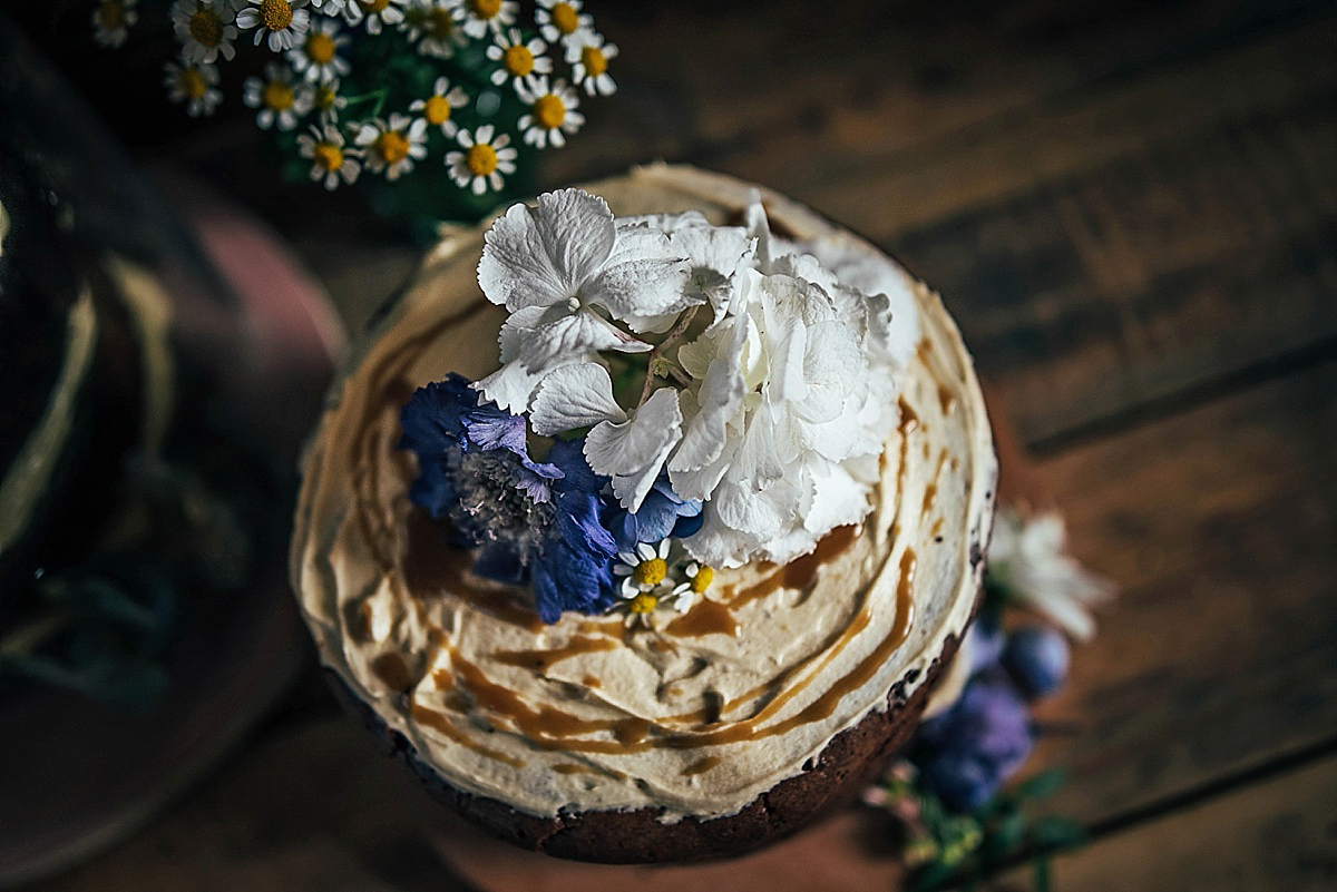 Bride Amelia wore a pale blue/grey Self Portrait dress for her handmade and stripped back, non traditional wedding. Captured by Three Flowers Photography.