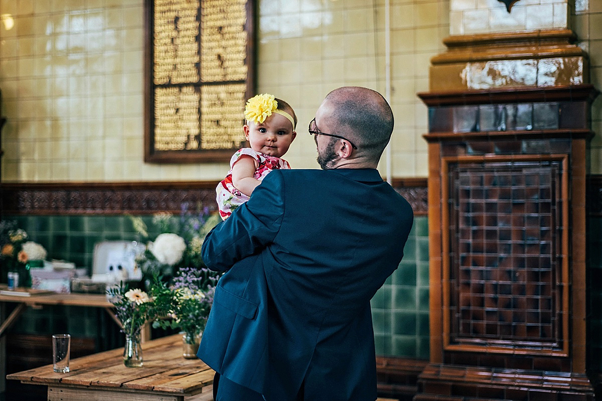 Bride Amelia wore a pale blue/grey Self Portrait dress for her handmade and stripped back, non traditional wedding. Captured by Three Flowers Photography.