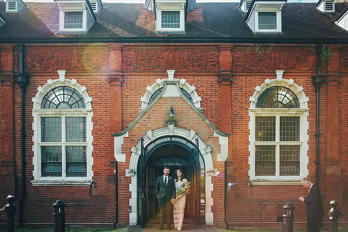 Bride Amelia wore a pale blue/grey Self Portrait dress for her handmade and stripped back, non traditional wedding. Captured by Three Flowers Photography.