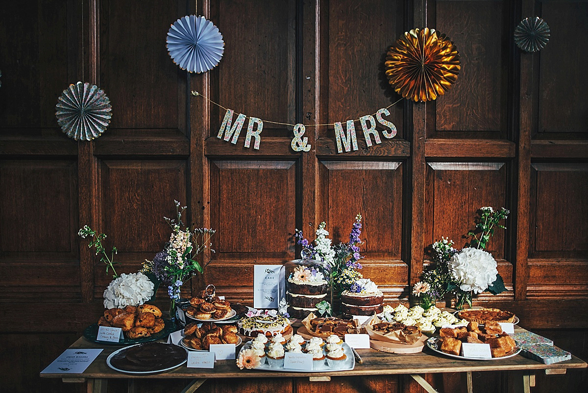 Bride Amelia wore a pale blue/grey Self Portrait dress for her handmade and stripped back, non traditional wedding. Captured by Three Flowers Photography.