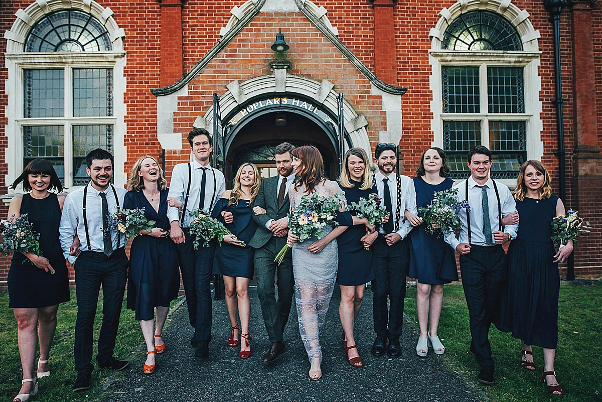 Bride Amelia wore a pale blue/grey Self Portrait dress for her handmade and stripped back, non traditional wedding. Captured by Three Flowers Photography.