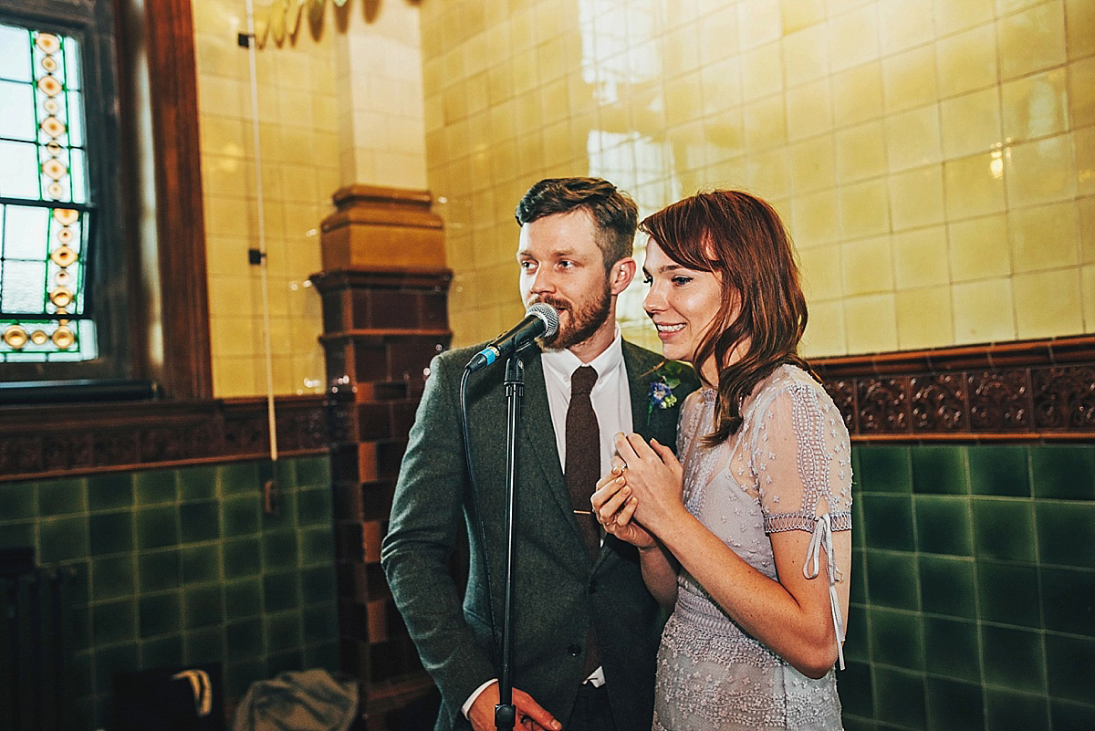 Bride Amelia wore a pale blue/grey Self Portrait dress for her handmade and stripped back, non traditional wedding. Captured by Three Flowers Photography.