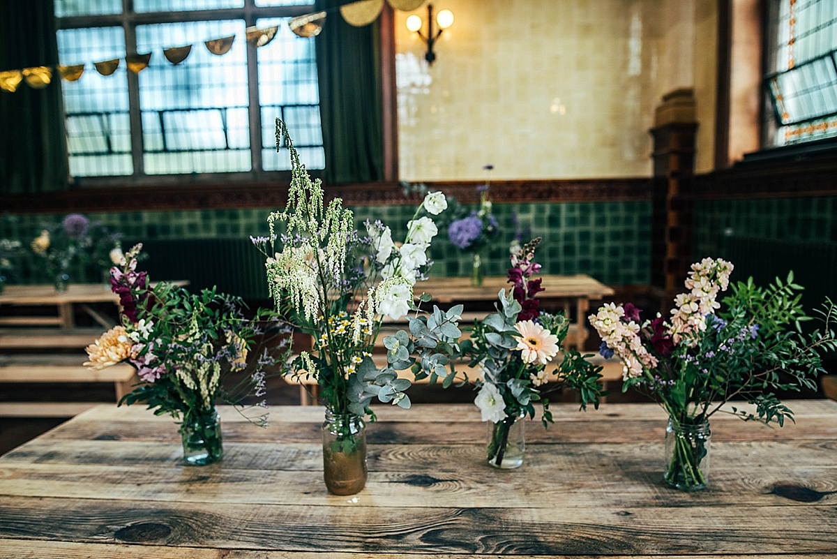Bride Amelia wore a pale blue/grey Self Portrait dress for her handmade and stripped back, non traditional wedding. Captured by Three Flowers Photography.