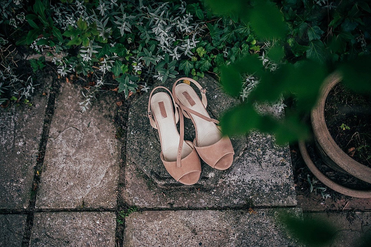 Bride Amelia wore a pale blue/grey Self Portrait dress for her handmade and stripped back, non traditional wedding. Captured by Three Flowers Photography.