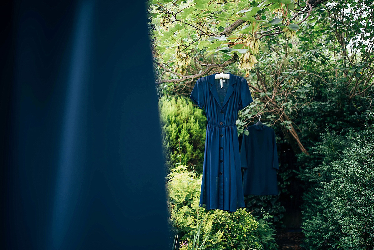 Bride Amelia wore a pale blue/grey Self Portrait dress for her handmade and stripped back, non traditional wedding. Captured by Three Flowers Photography.