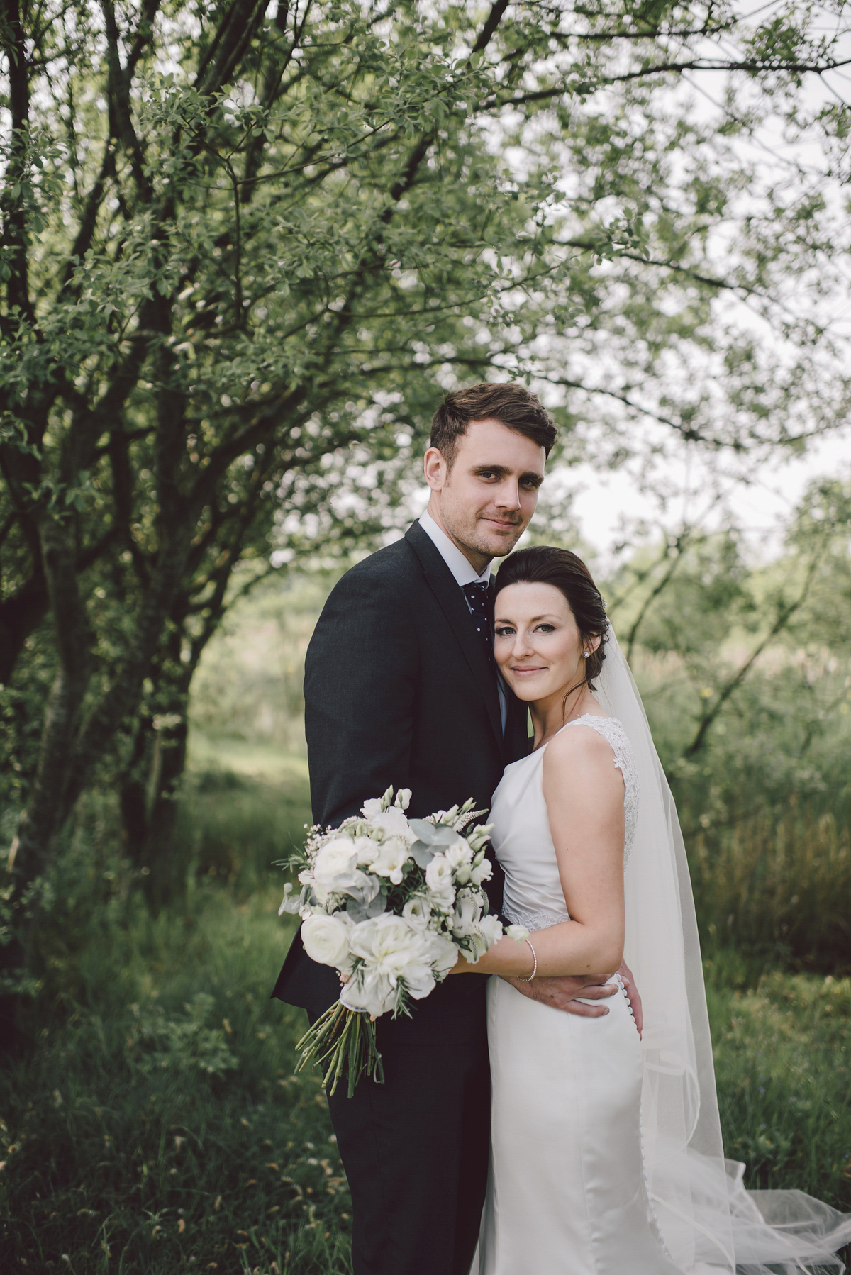 Bride Nina wore a Sincerity gown for her rustic and handmade Spring country barn wedding. Photography by Roberta Matis.