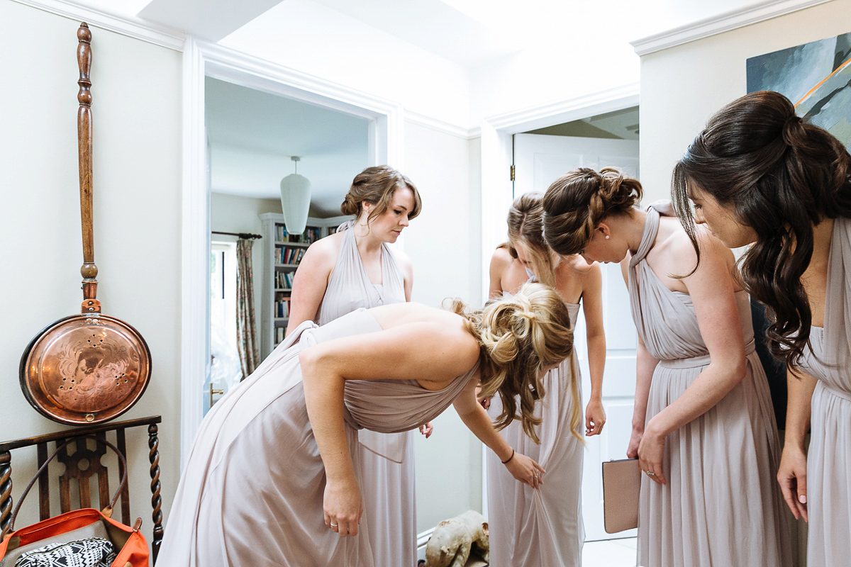 Bride Sophie wore an Amanda Wakeley gown for her fuss-free, stylish, military wedding in the Suffolk countryside. Photography by Nick Tucker.