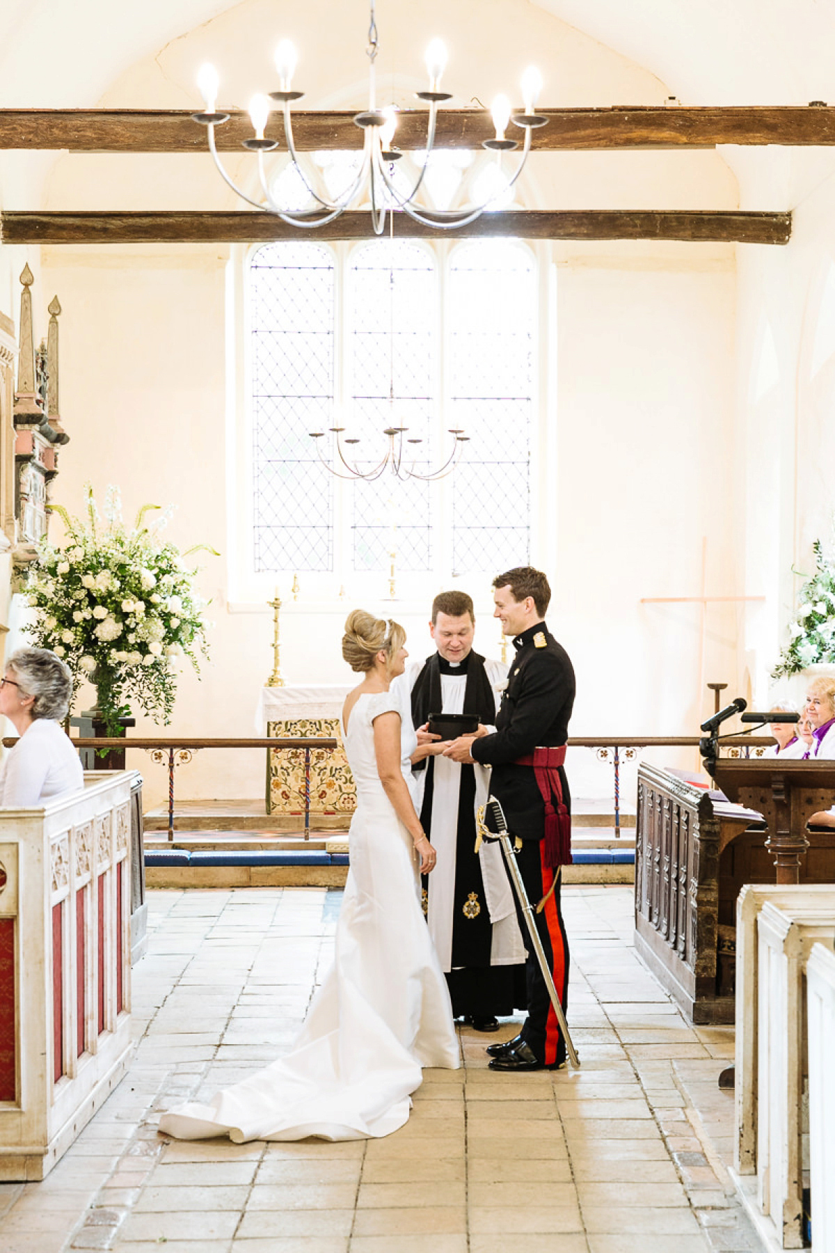 Bride Sophie wore an Amanda Wakeley gown for her fuss-free, stylish, military wedding in the Suffolk countryside. Photography by Nick Tucker.