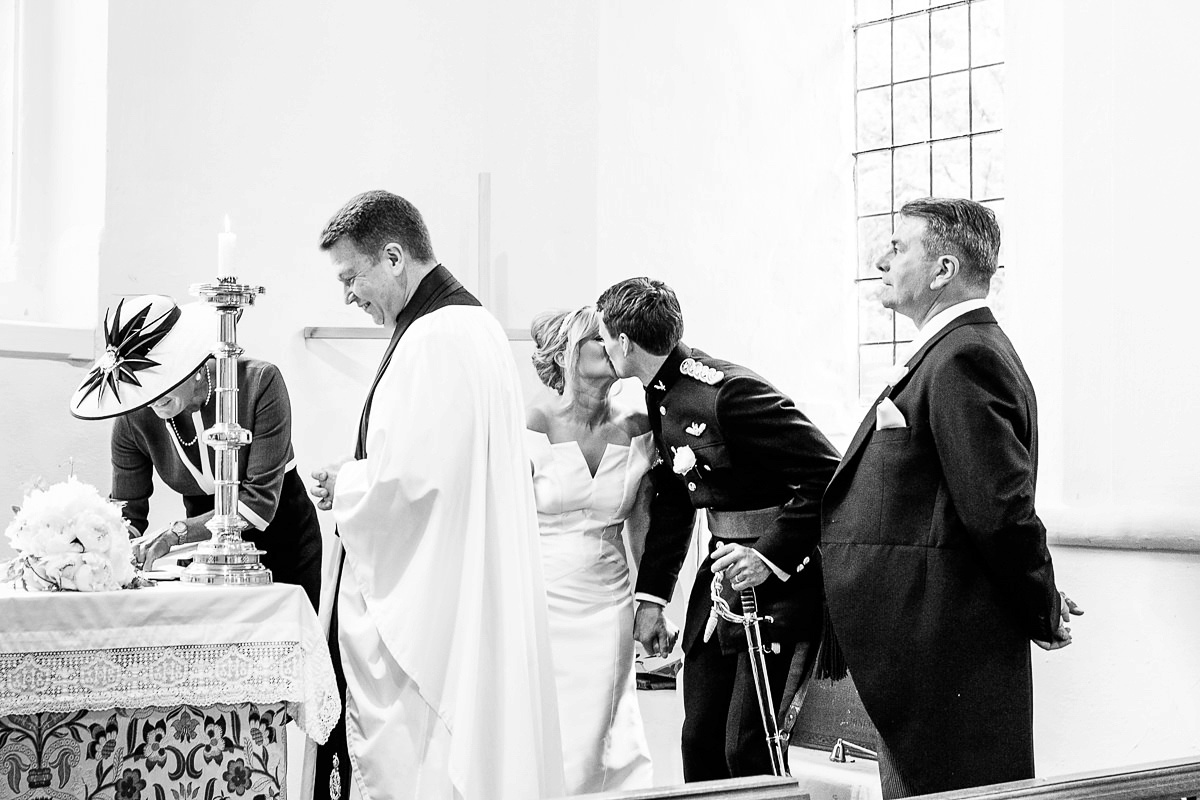 Bride Sophie wore an Amanda Wakeley gown for her fuss-free, stylish, military wedding in the Suffolk countryside. Photography by Nick Tucker.