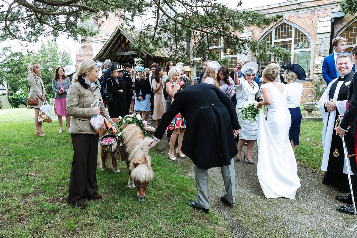 Bride Sophie wore an Amanda Wakeley gown for her fuss-free, stylish, military wedding in the Suffolk countryside. Photography by Nick Tucker.