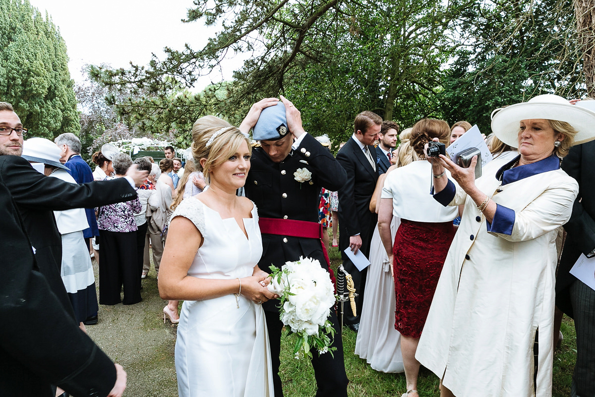 Bride Sophie wore an Amanda Wakeley gown for her fuss-free, stylish, military wedding in the Suffolk countryside. Photography by Nick Tucker.