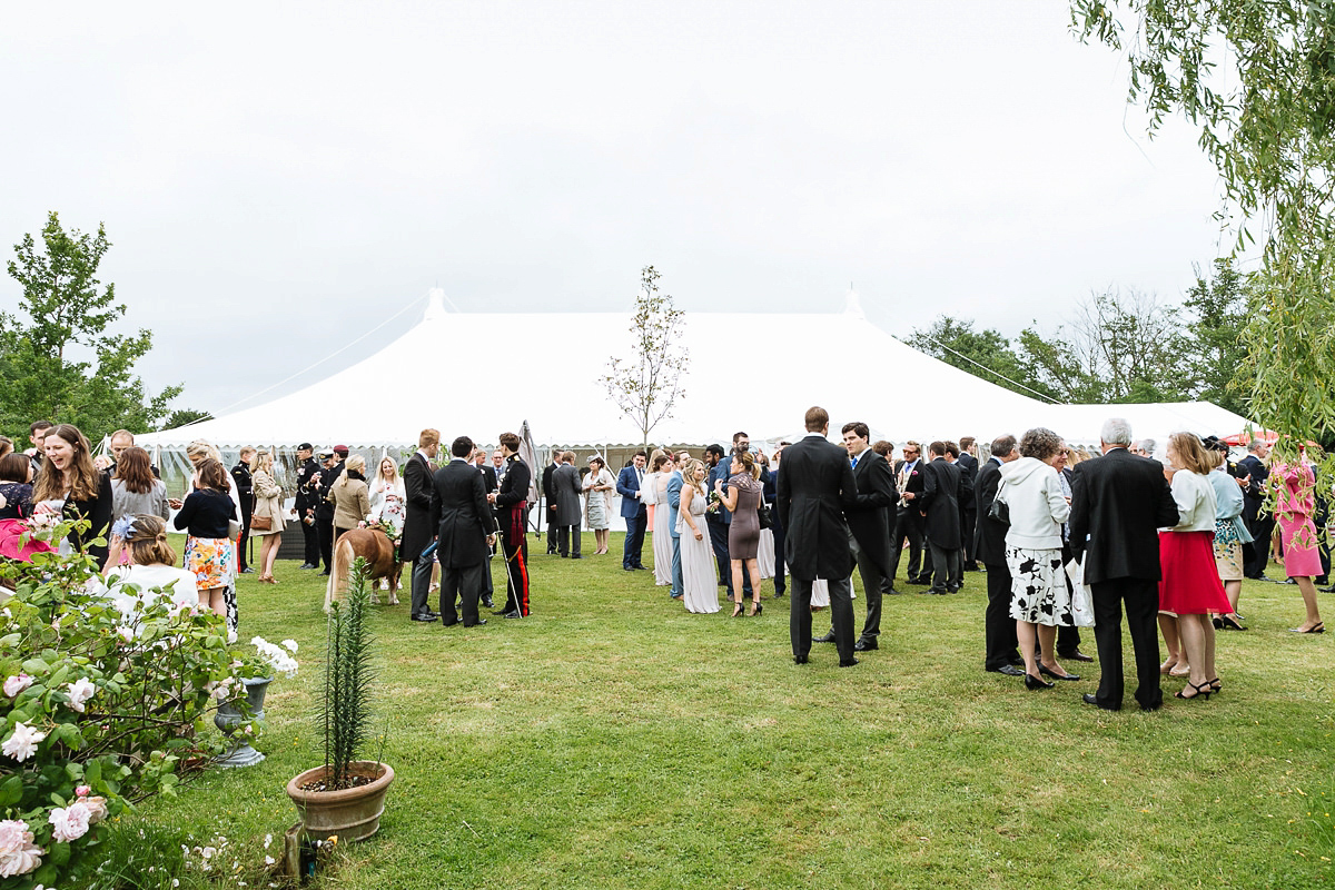 Bride Sophie wore an Amanda Wakeley gown for her fuss-free, stylish, military wedding in the Suffolk countryside. Photography by Nick Tucker.