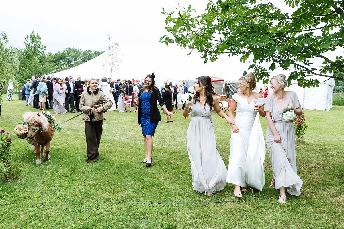 Bride Sophie wore an Amanda Wakeley gown for her fuss-free, stylish, military wedding in the Suffolk countryside. Photography by Nick Tucker.