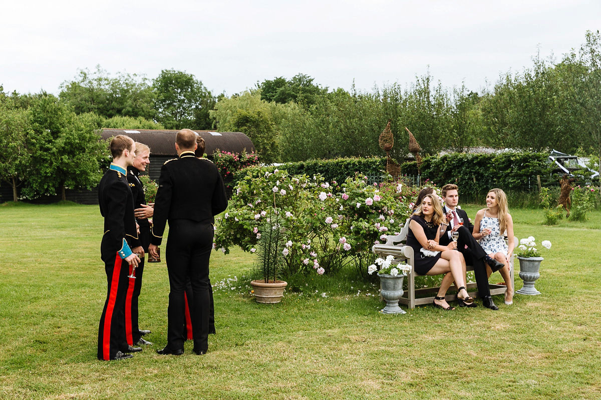 Bride Sophie wore an Amanda Wakeley gown for her fuss-free, stylish, military wedding in the Suffolk countryside. Photography by Nick Tucker.