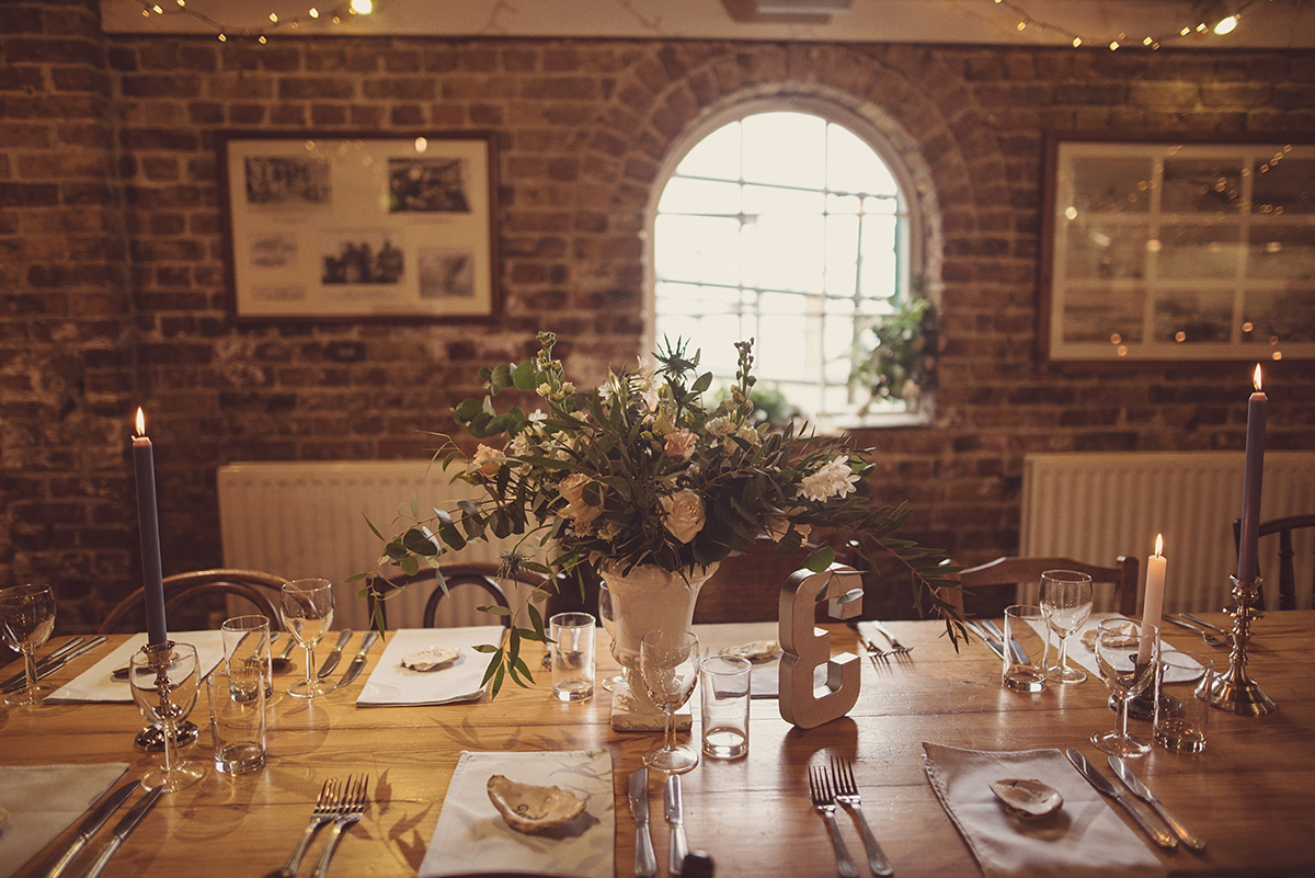 Florist Joanne of Joanne Truby Floral Design wore Stewart Parvin to marry her beau Steve by the sea in Whitstable. Photography by Rebecca Douglas.