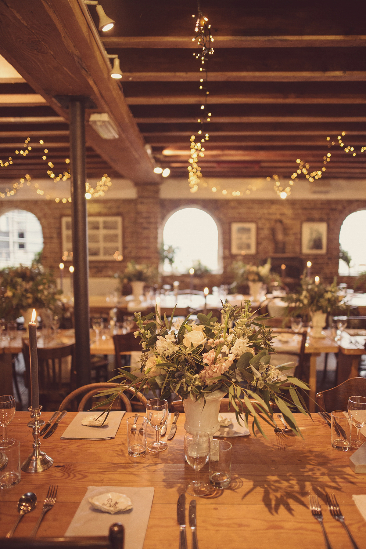 Florist Joanne of Joanne Truby Floral Design wore Stewart Parvin to marry her beau Steve by the sea in Whitstable. Photography by Rebecca Douglas.