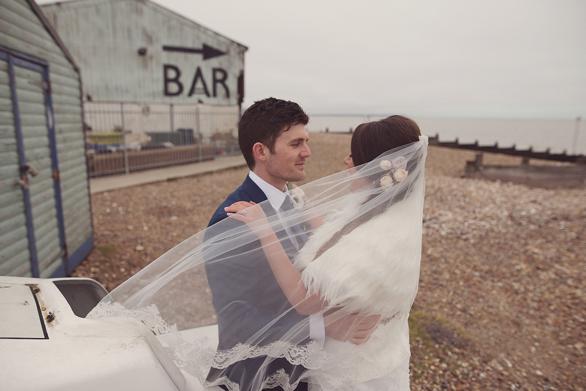 Florist Joanne of Joanne Truby Floral Design wore Stewart Parvin to marry her beau Steve by the sea in Whitstable. Photography by Rebecca Douglas.