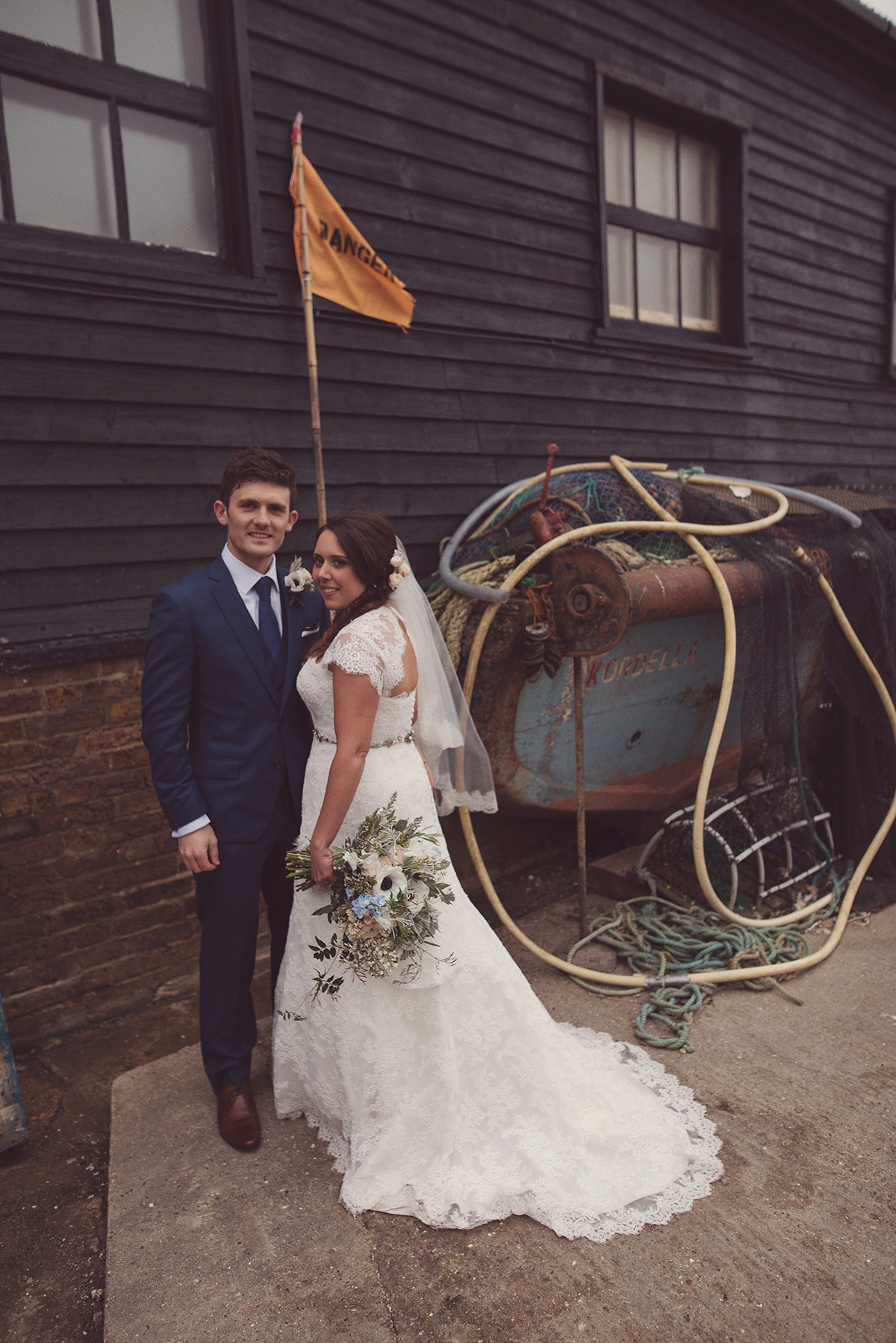 Florist Joanne of Joanne Truby Floral Design wore Stewart Parvin to marry her beau Steve by the sea in Whitstable. Photography by Rebecca Douglas.