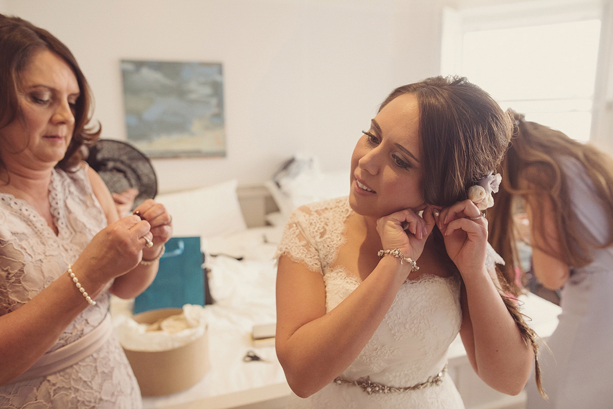 Florist Joanne of Joanne Truby Floral Design wore Stewart Parvin to marry her beau Steve by the sea in Whitstable. Photography by Rebecca Douglas.