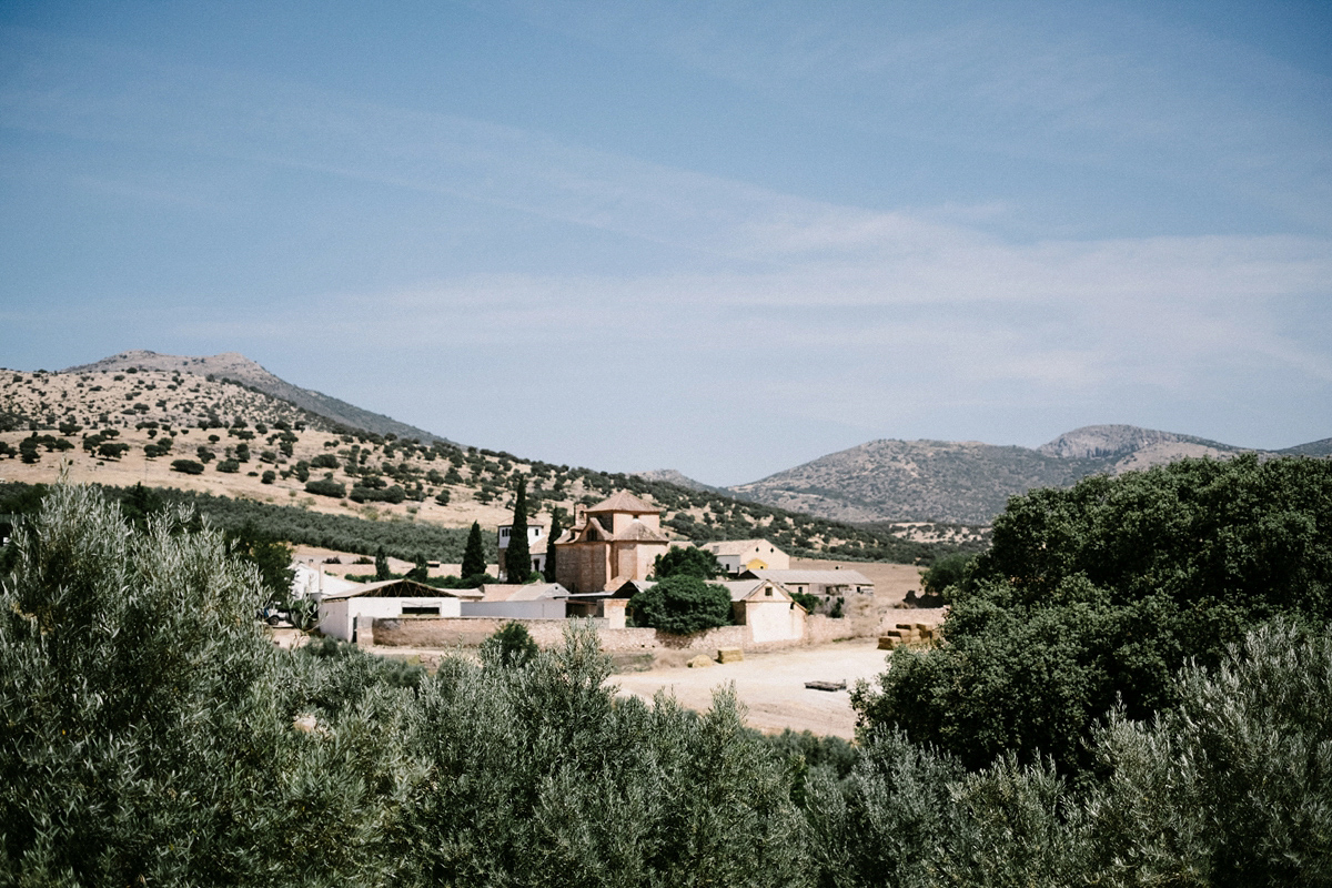 Bride Laura wears a bespoke wedding dress by Wilden Bride for her elegant destination wedding in Spain. Photography by Claudia Rose Carter.