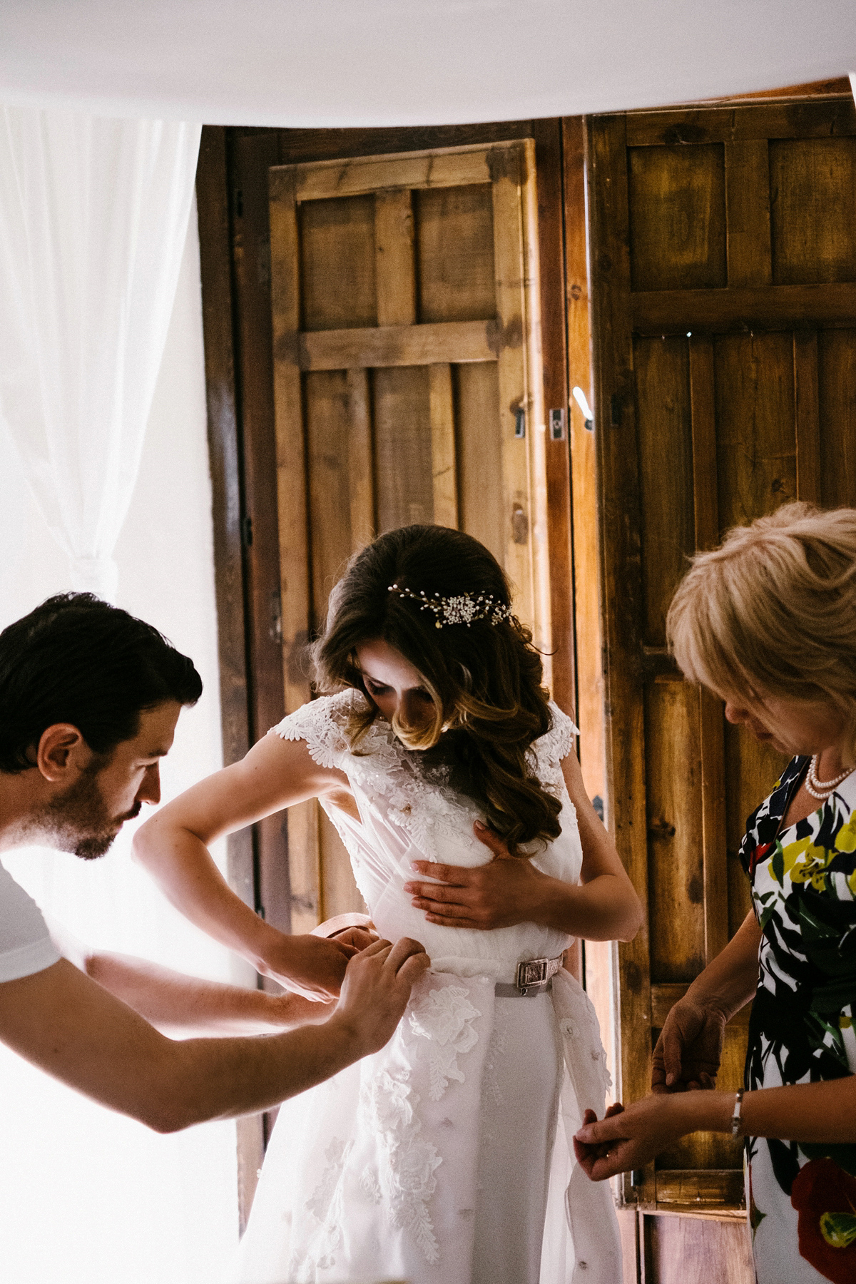 Bride Laura wears a bespoke wedding dress by Wilden Bride for her elegant destination wedding in Spain. Photography by Claudia Rose Carter.