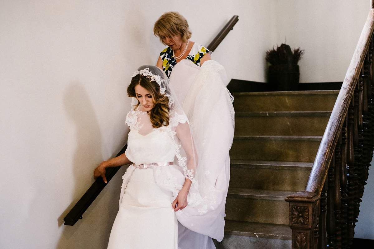 Bride Laura wears a bespoke wedding dress by Wilden Bride for her elegant destination wedding in Spain. Photography by Claudia Rose Carter.