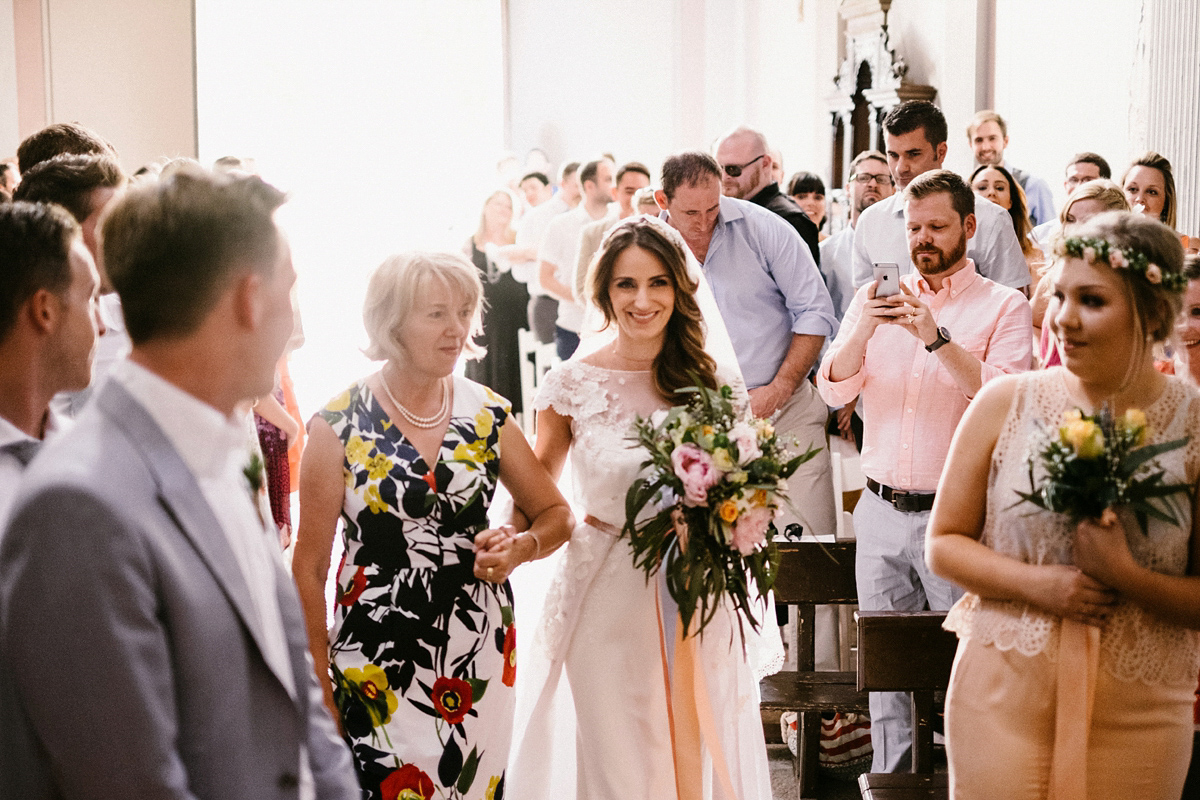 Bride Laura wears a bespoke wedding dress by Wilden Bride for her elegant destination wedding in Spain. Photography by Claudia Rose Carter.