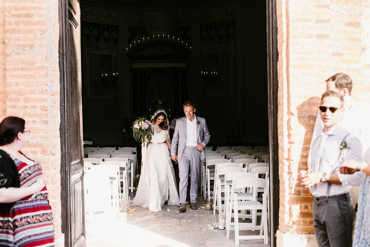 Bride Laura wears a bespoke wedding dress by Wilden Bride for her elegant destination wedding in Spain. Photography by Claudia Rose Carter.