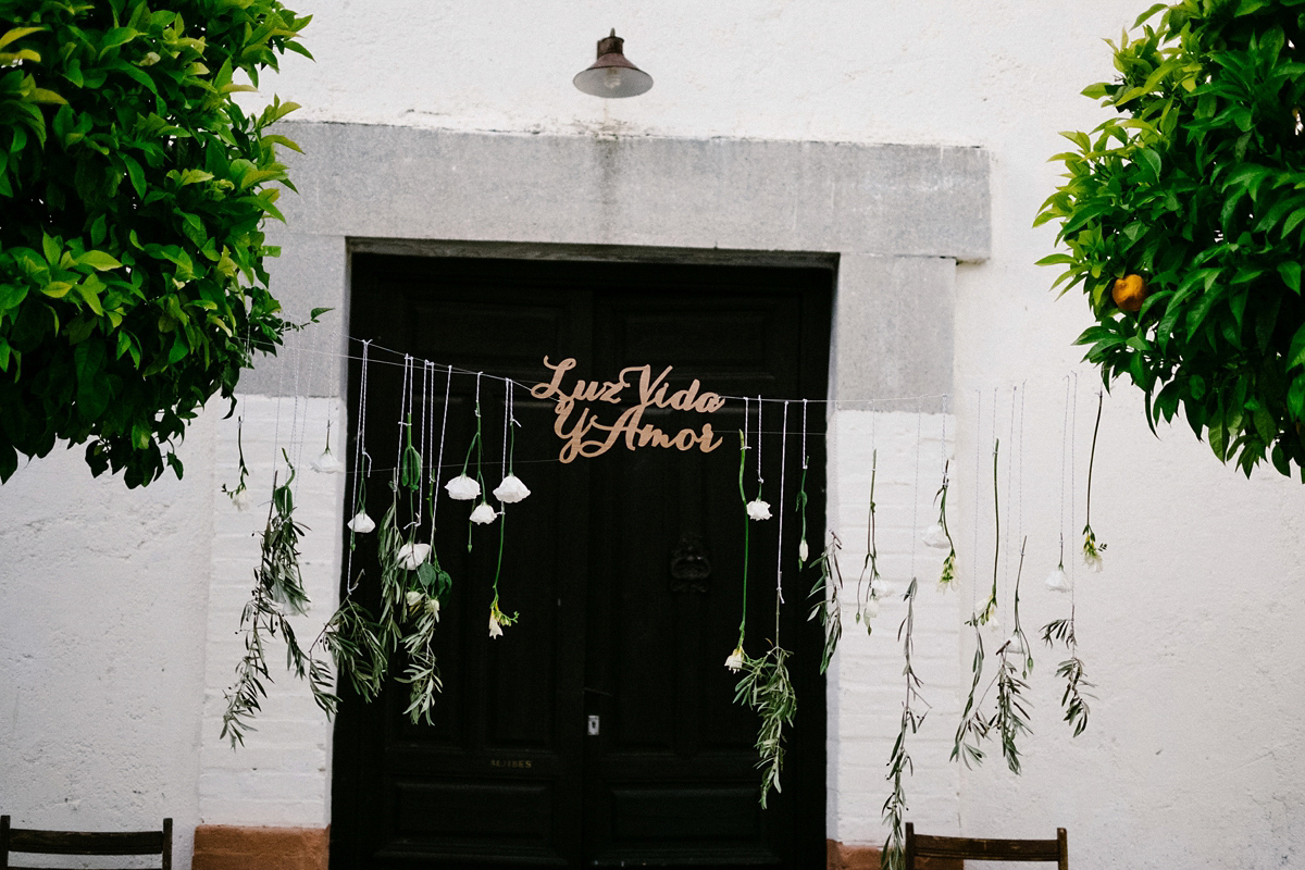 Bride Laura wears a bespoke wedding dress by Wilden Bride for her elegant destination wedding in Spain. Photography by Claudia Rose Carter.