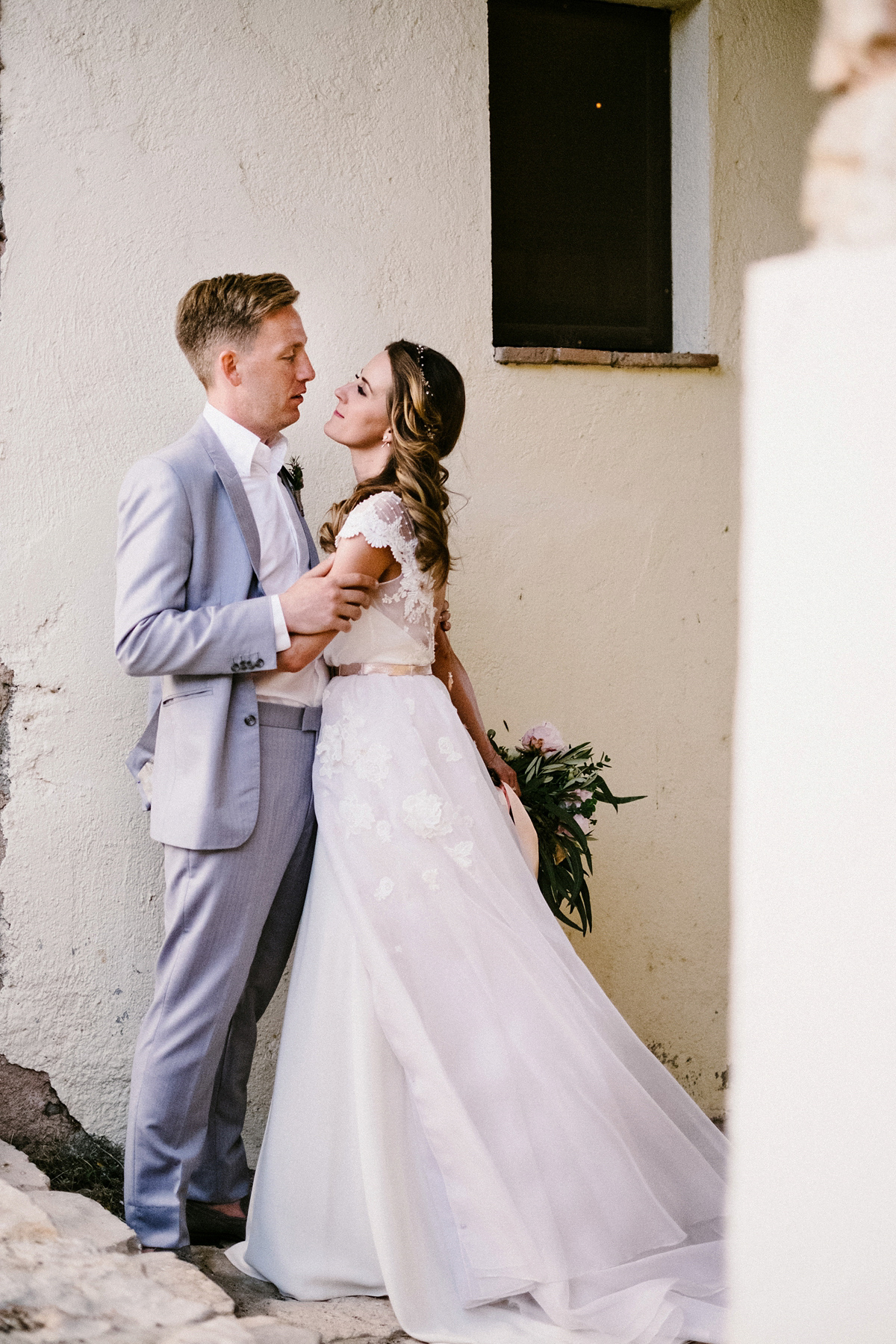 Bride Laura wears a bespoke wedding dress by Wilden Bride for her elegant destination wedding in Spain. Photography by Claudia Rose Carter.