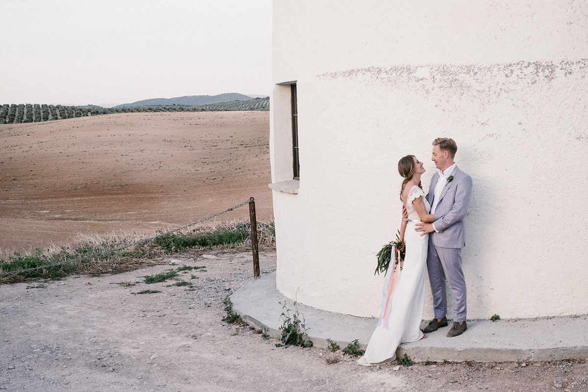 Bride Laura wears a bespoke wedding dress by Wilden Bride for her elegant destination wedding in Spain. Photography by Claudia Rose Carter.