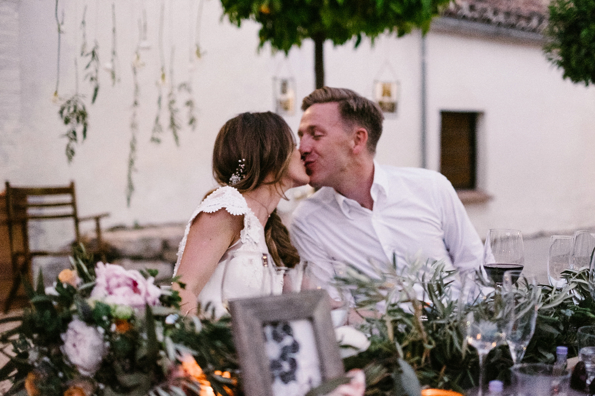 Bride Laura wears a bespoke wedding dress by Wilden Bride for her elegant destination wedding in Spain. Photography by Claudia Rose Carter.