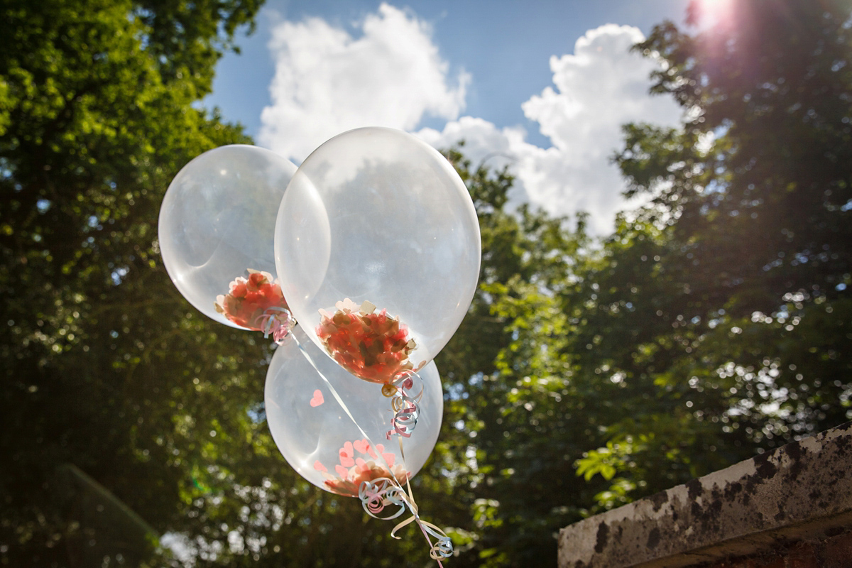 Emily wore Jenny Packham's 'Aspen' gown for her quintessentially English country house wedding in pastel shades.