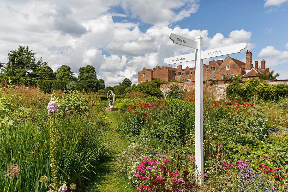 Emily wore Jenny Packham's 'Aspen' gown for her quintessentially English country house wedding in pastel shades.