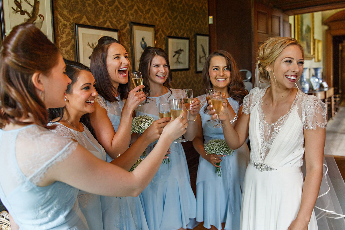 Emily wore Jenny Packham's 'Aspen' gown for her quintessentially English country house wedding in pastel shades.