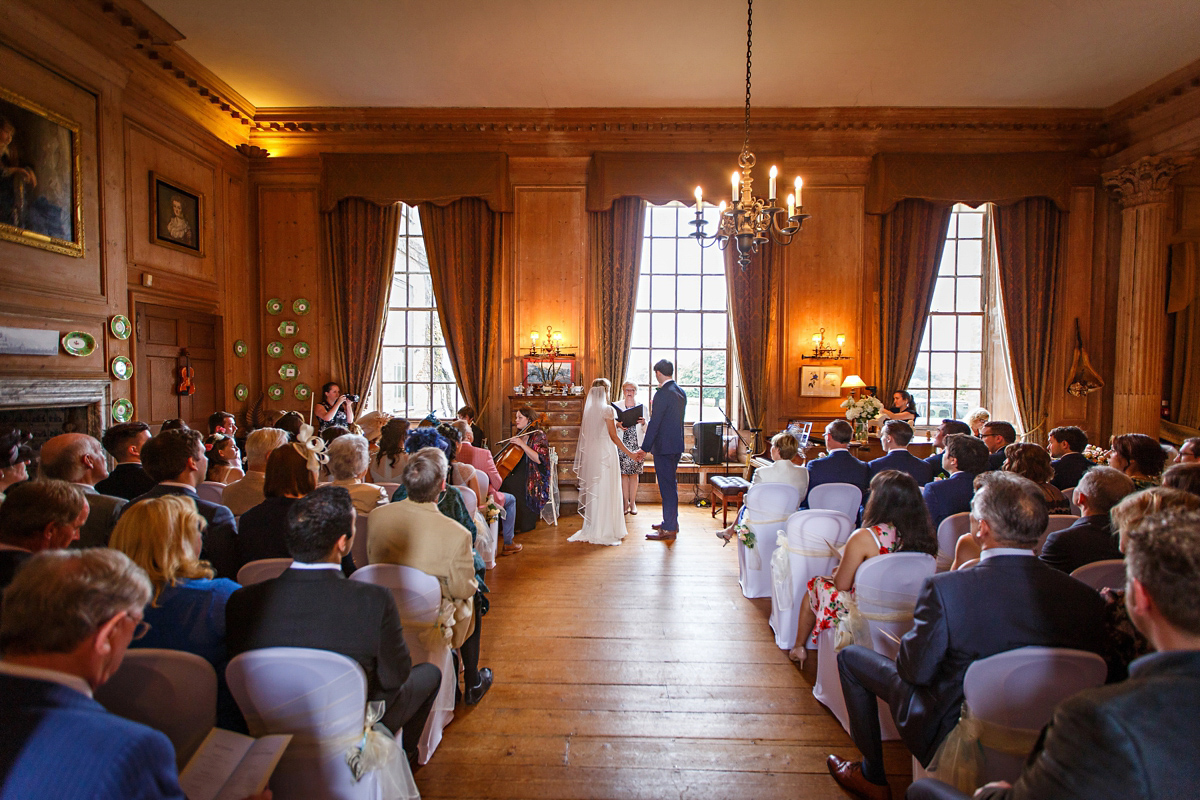 Emily wore Jenny Packham's 'Aspen' gown for her quintessentially English country house wedding in pastel shades.