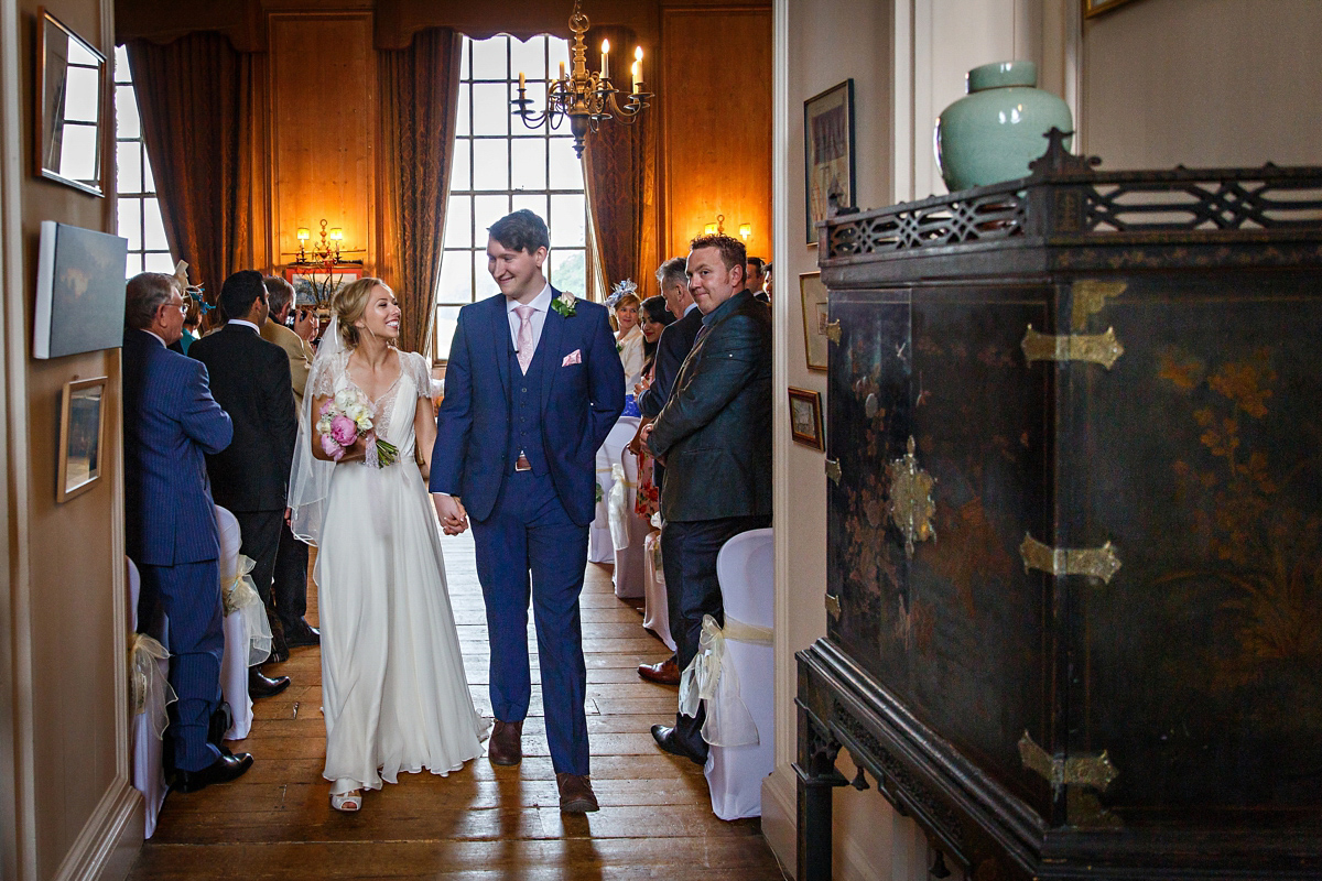 Emily wore Jenny Packham's 'Aspen' gown for her quintessentially English country house wedding in pastel shades.