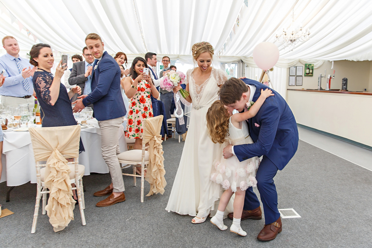 Emily wore Jenny Packham's 'Aspen' gown for her quintessentially English country house wedding in pastel shades.