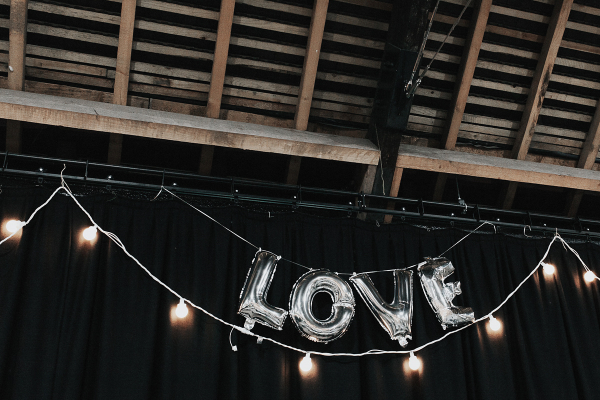 A short wedding dress and birdcage veil for a 1960's inspired bride. Image by Indie Photography.