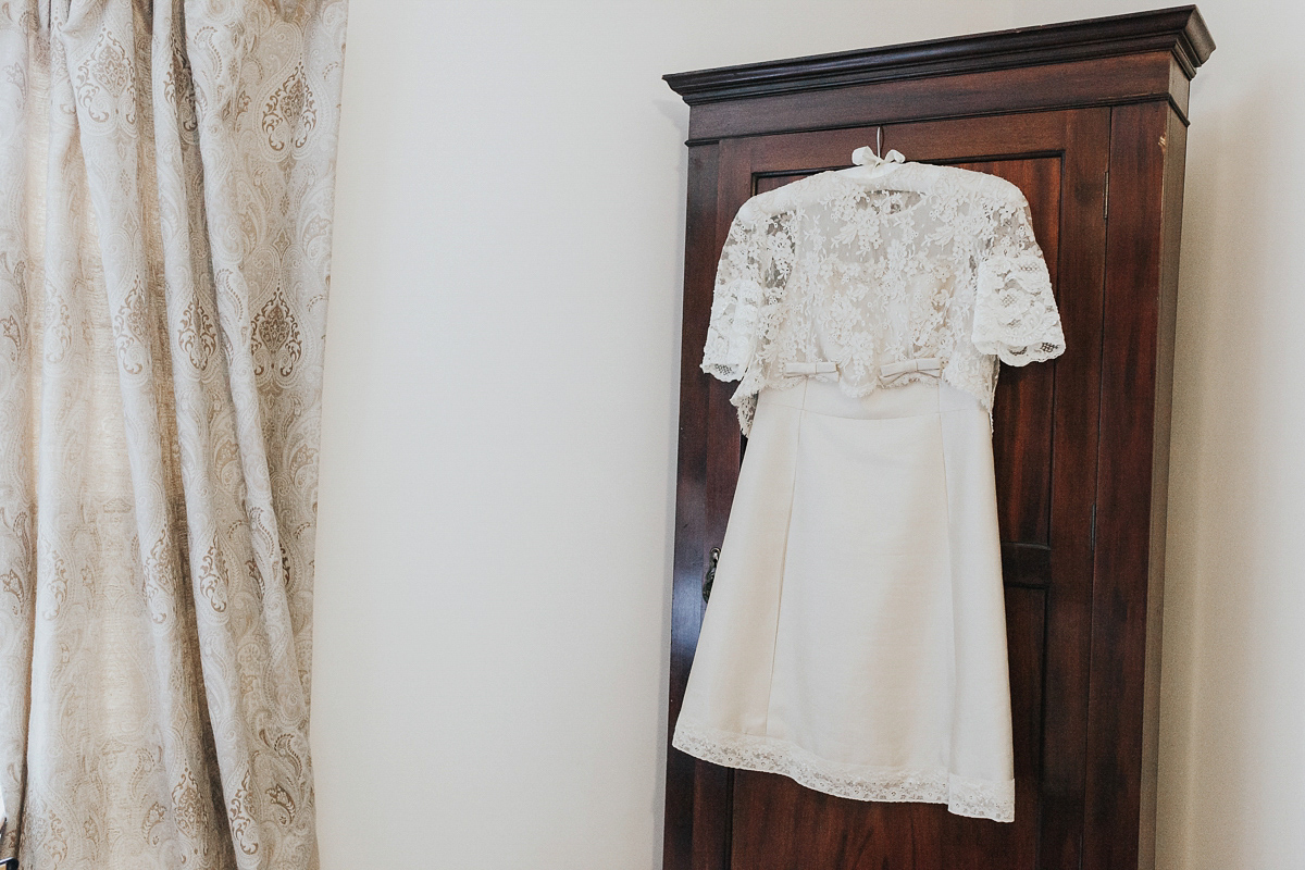 A short wedding dress and birdcage veil for a 1960's inspired bride. Image by Indie Photography.